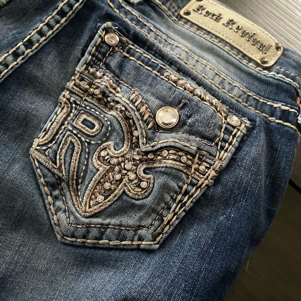 Rock Revival Blue Jeans with Embroidered Details and Distressed Finish